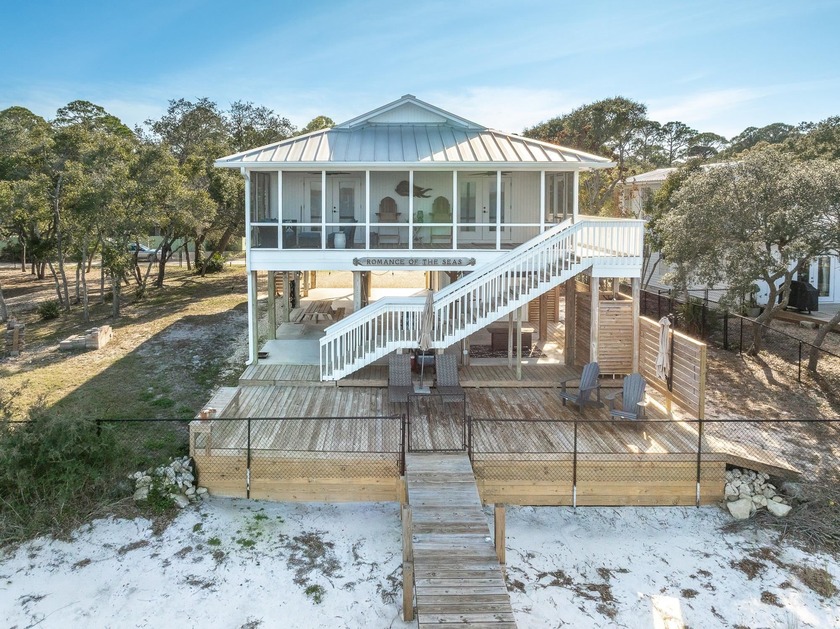 Enjoy spectacular Bayfront sunrises from this beautifully - Beach Home for sale in Alligator Point, Florida on Beachhouse.com