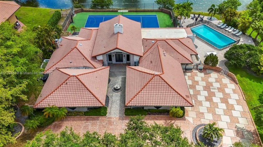 Embrace elevated living in this exquisite lakefront estate - Beach Home for sale in Coral Springs, Florida on Beachhouse.com