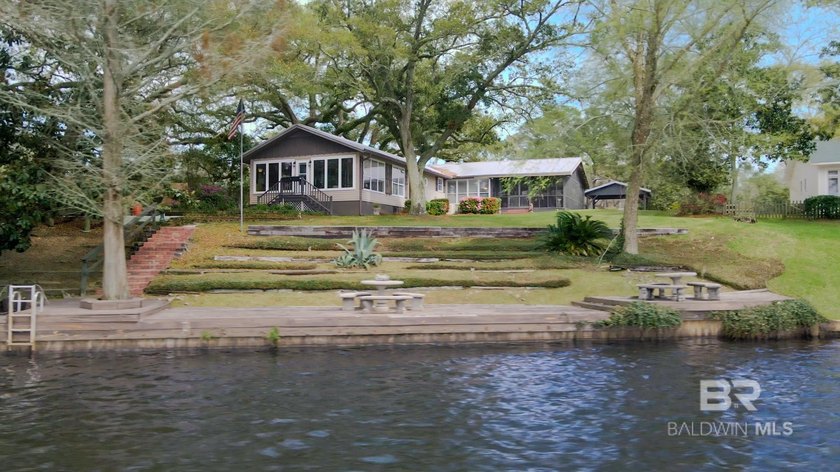 Located on the scenic waters of Fowl River, this waterfront - Beach Home for sale in Theodore, Alabama on Beachhouse.com