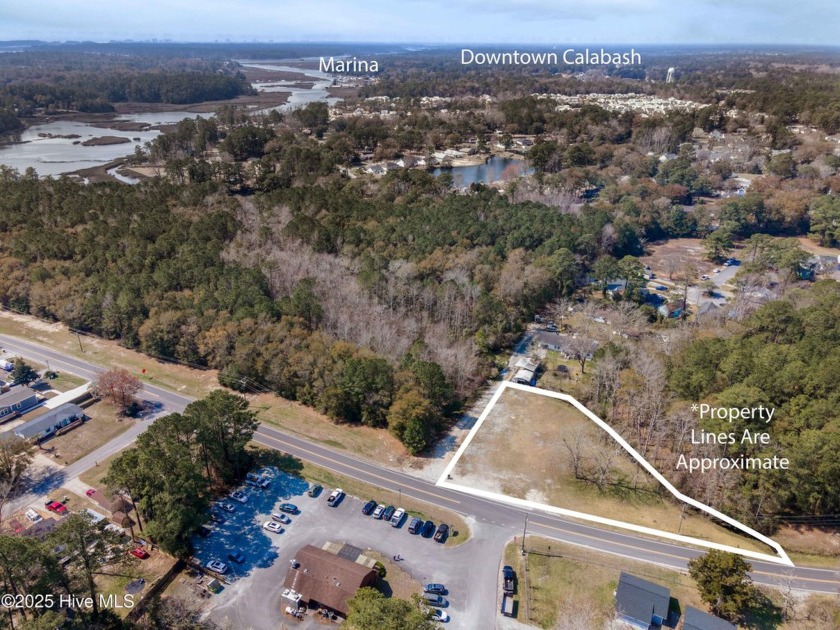This 0.82-acre COMMERCIALLY ZONED lot offers excellent road - Beach Lot for sale in Calabash, North Carolina on Beachhouse.com
