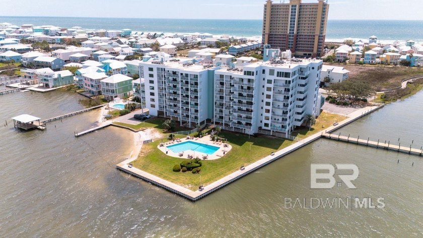Enjoy sweeping, unobstructed lagoon views from this beautifully - Beach Home for sale in Gulf Shores, Alabama on Beachhouse.com