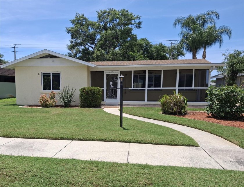 This beautiful large home with old Florida charm is nestled in - Beach Home for sale in Bradenton, Florida on Beachhouse.com
