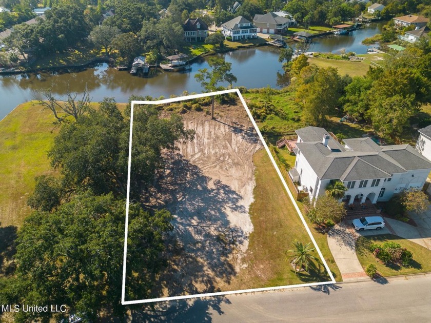 This stunning waterfront lot, located on a peaceful canal in the - Beach Lot for sale in Gulfport, Mississippi on Beachhouse.com