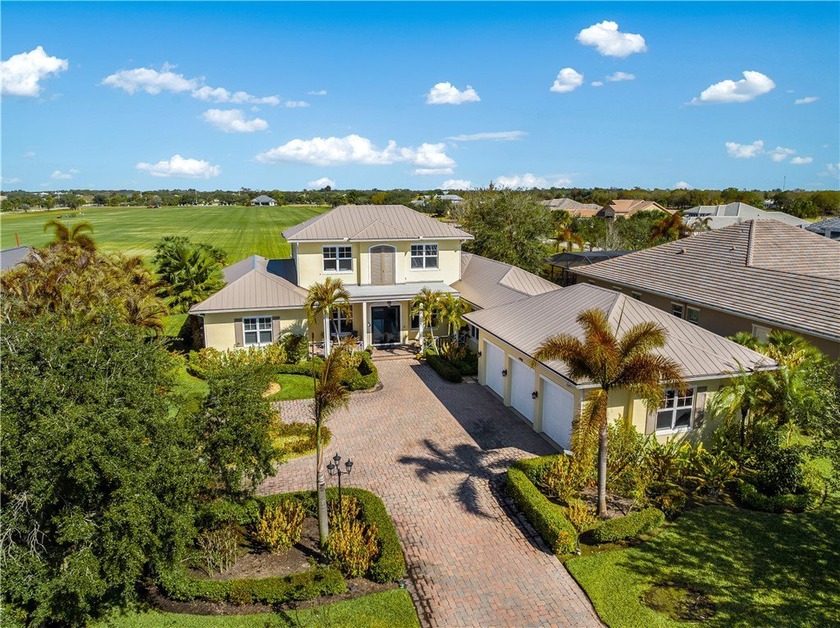 Located within the gated Polo Grounds, this custom home offers - Beach Home for sale in Vero Beach, Florida on Beachhouse.com