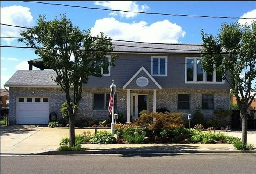 This beautifully maintained home features 4 full bedrooms plus - Beach Home for sale in Freeport, New York on Beachhouse.com
