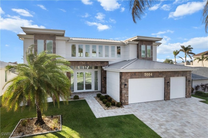 This breathtaking 5-bedroom, 5.5-bathroom sanctuary in Cape - Beach Home for sale in Cape Coral, Florida on Beachhouse.com