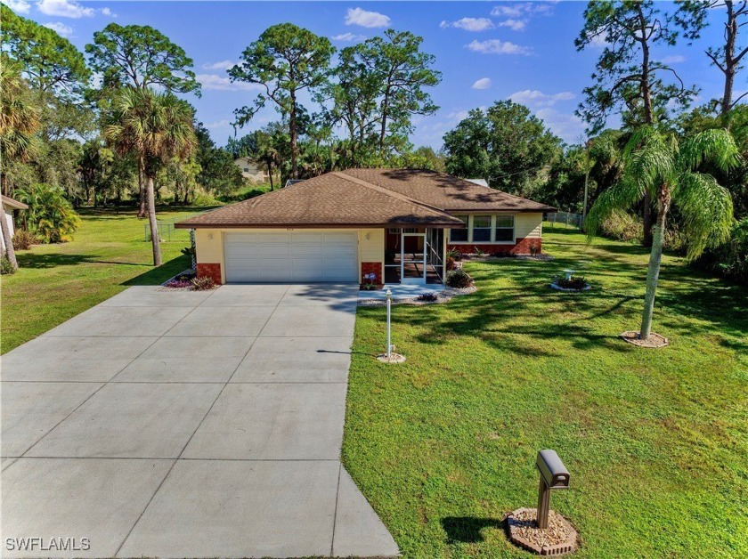 Welcome to this almost 2,000 sq ft. 4/2 POOL home with a custom - Beach Home for sale in Lehigh Acres, Florida on Beachhouse.com