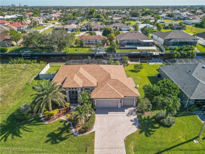 This custom Gulf-access home on a rare triple lot is a dream for - Beach Home for sale in Cape Coral, Florida on Beachhouse.com