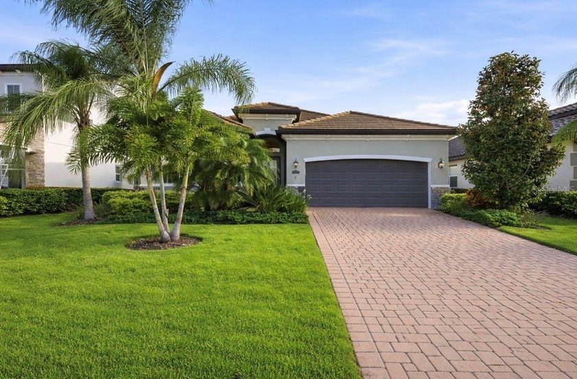 Welcome to this pristine, designer-inspired residence located in - Beach Home for sale in Lakewood Ranch, Florida on Beachhouse.com