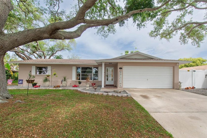 Welcome to this beautifully maintained 3-bedroom, 2-bath, 2 car - Beach Home for sale in Largo, Florida on Beachhouse.com