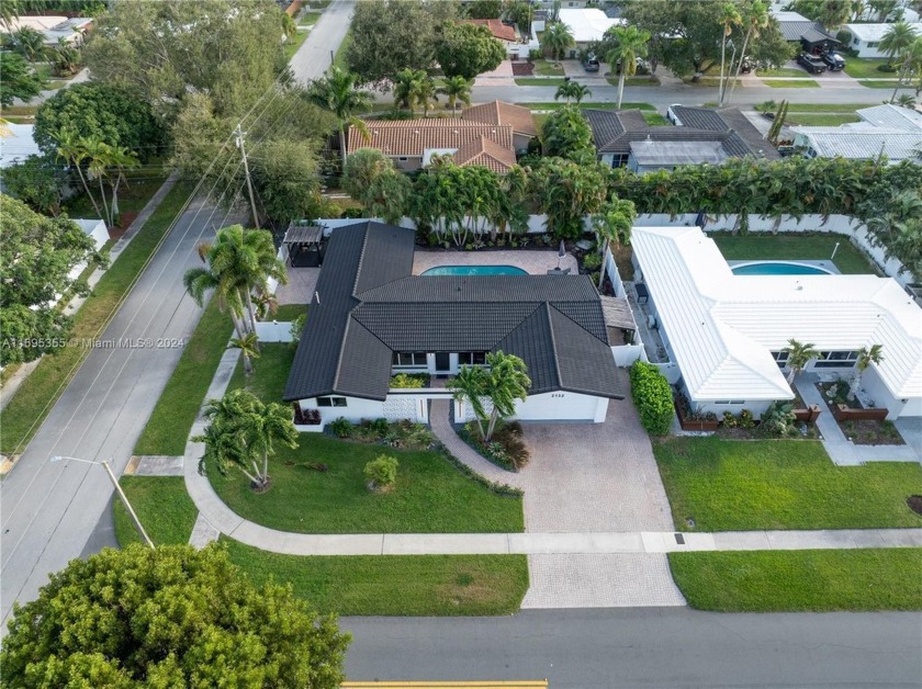 Welcome to this luxurious 4-bedroom, 3-bathroom corner home that - Beach Home for sale in Fort Lauderdale, Florida on Beachhouse.com