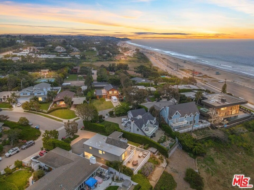 Perched above the iconic Zuma Beach, this updated Cape Cod - Beach Home for sale in Malibu, California on Beachhouse.com