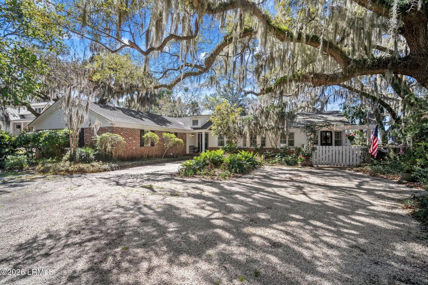 Set on a .66-acre waterfront lot along tidal Battery Creek, this - Beach Home for sale in Beaufort, South Carolina on Beachhouse.com