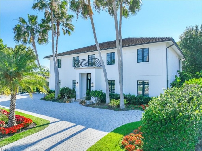 This elegant home showcases a spacious open layout, boasting - Beach Home for sale in Naples, Florida on Beachhouse.com