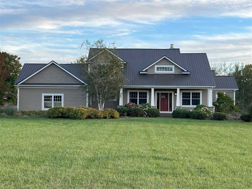 Watch the sunrise and the sunset from this beautiful custom - Beach Home for sale in Charlevoix, Michigan on Beachhouse.com