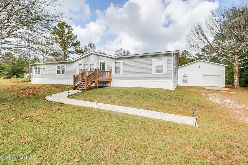 Nestled in the serene Landon Lake Estates, this inviting - Beach Home for sale in Gulfport, Mississippi on Beachhouse.com