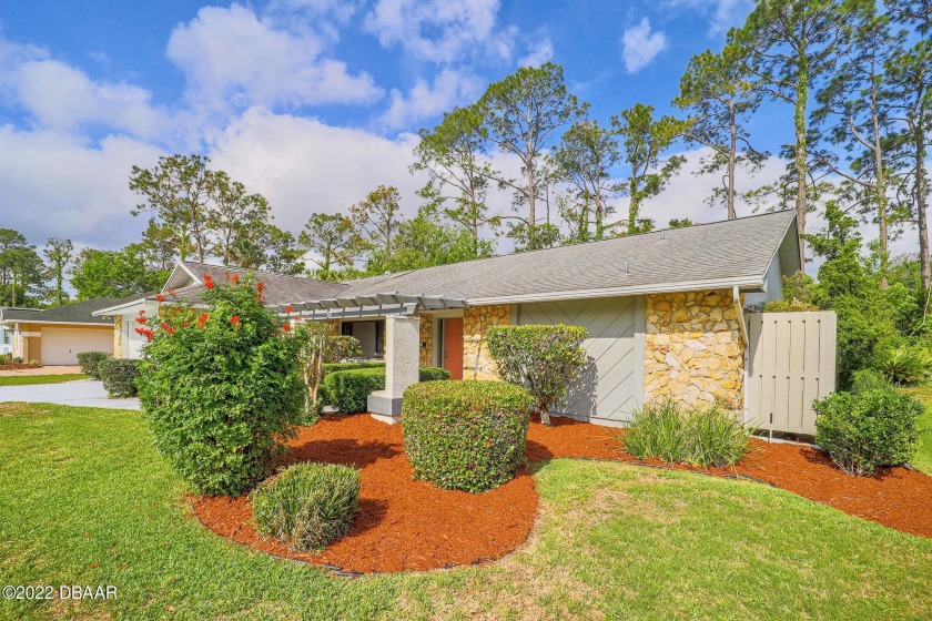 This a MUST see beautifully landscaped home with a 2 car garage - Beach Home for sale in Palm Coast, Florida on Beachhouse.com