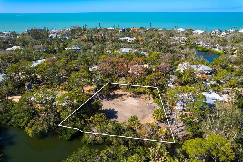 Tucked beneath a canopy of mature trees in the prestigious - Beach Lot for sale in Sarasota, Florida on Beachhouse.com