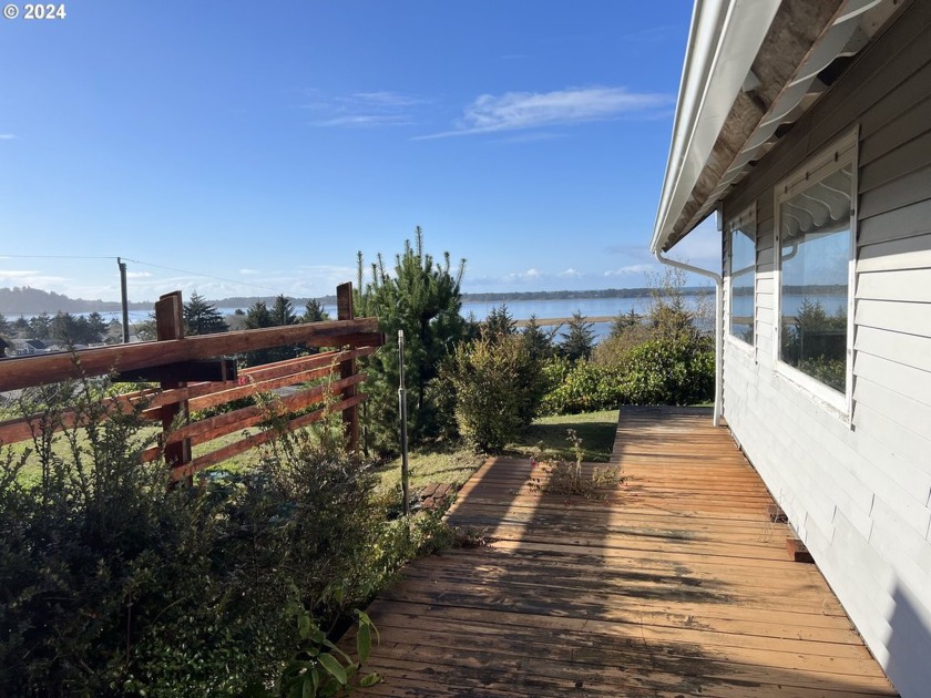 This listing is a unique ocean and Siletz River view opportunity - Beach Home for sale in Lincoln City, Oregon on Beachhouse.com