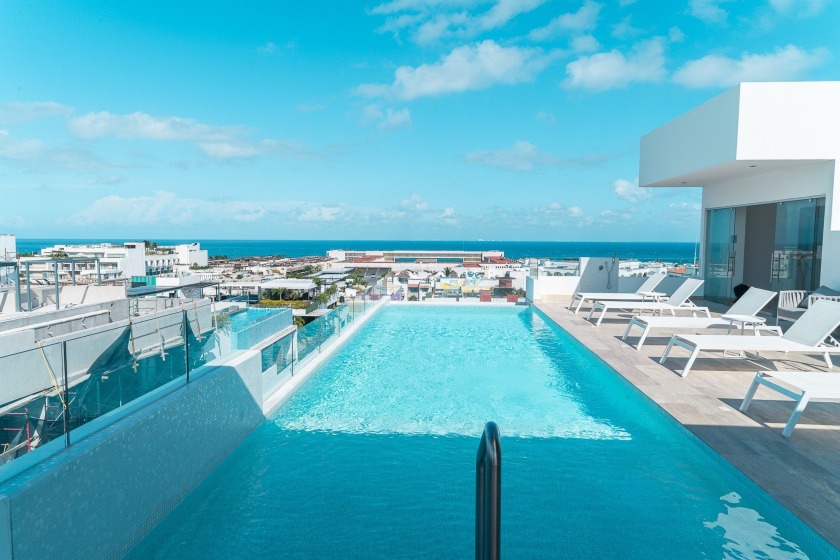 This modern 2 bedroom condo is located in the heart of Playa del - Beach Condo for sale in Playa Del Carmen,  on Beachhouse.com