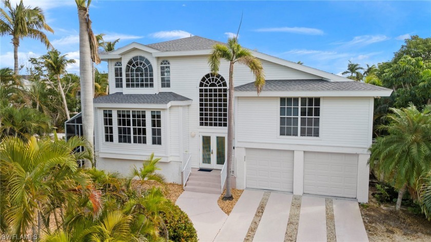 Situated on the island for easy access, this waterfront property - Beach Home for sale in Sanibel, Florida on Beachhouse.com