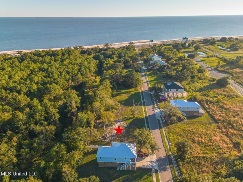 JUST LISTED-Nestled in the heart of Long Beach, this enchanting - Beach Lot for sale in Long Beach, Mississippi on Beachhouse.com