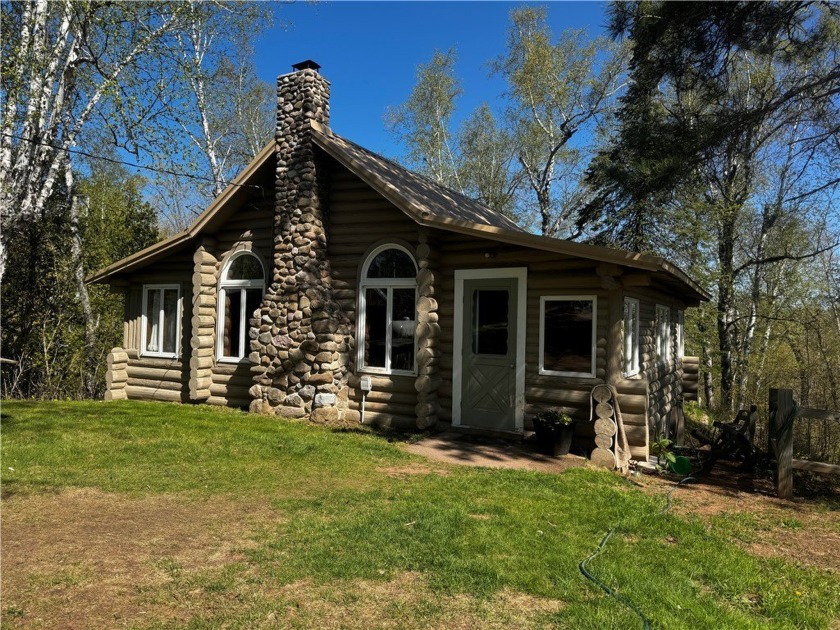 This enchanting traditional log cabin offers a unique blend of - Beach Home for sale in Herbster, Wisconsin on Beachhouse.com