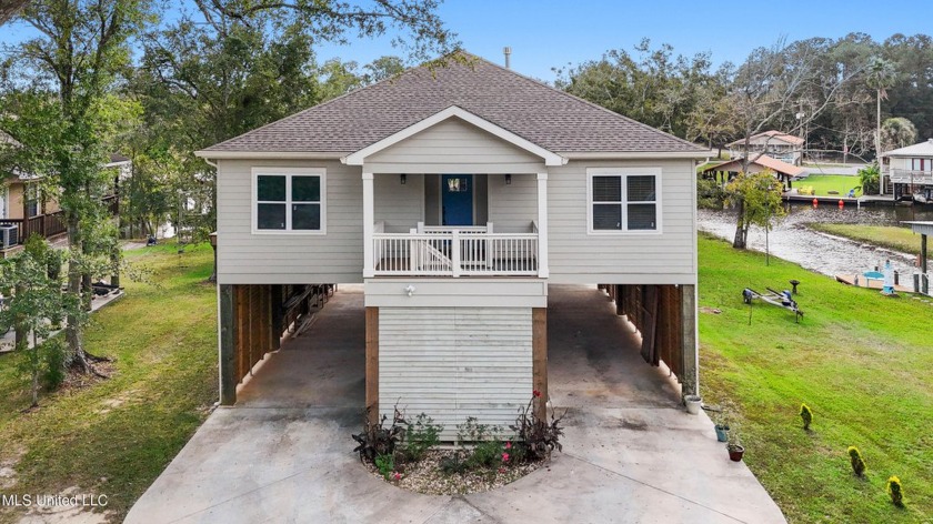 Discover the waterfront home of your dreams--this wow-worthy - Beach Home for sale in Gautier, Mississippi on Beachhouse.com