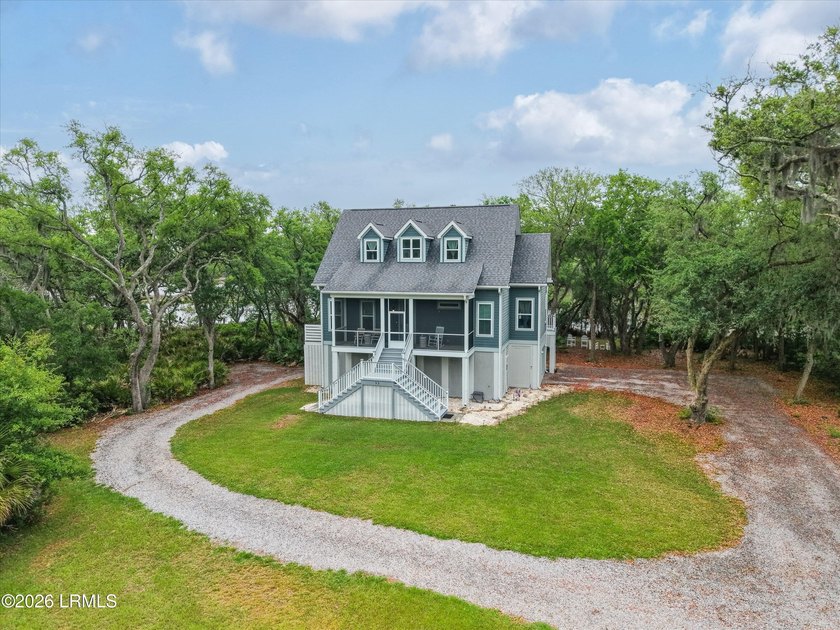 Set along the quiet, natural beauty of St. Helena Island, this - Beach Home for sale in Saint Helena Island, South Carolina on Beachhouse.com