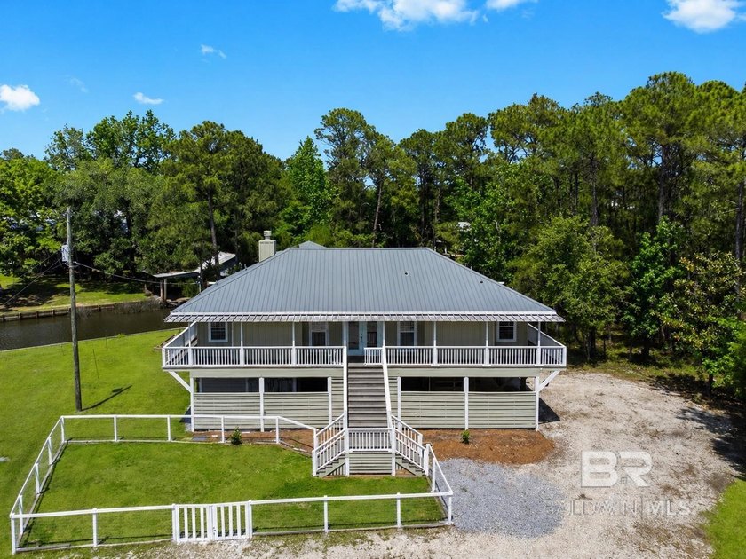 Experience waterfront living on Weeks Bay in this 3BR/2BA raised - Beach Home for sale in Fairhope, Alabama on Beachhouse.com