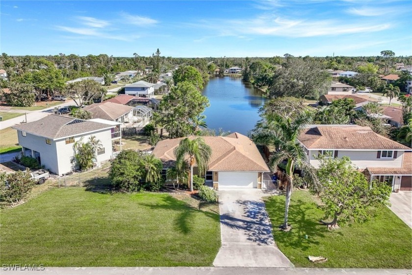 Charming Lakefront Home in San Carlos Park! Nestled in the - Beach Home for sale in Fort Myers, Florida on Beachhouse.com