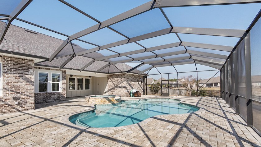 Overlooking a pristine lake in The Meadows at Hammock Bay, this - Beach Home for sale in Freeport, Florida on Beachhouse.com