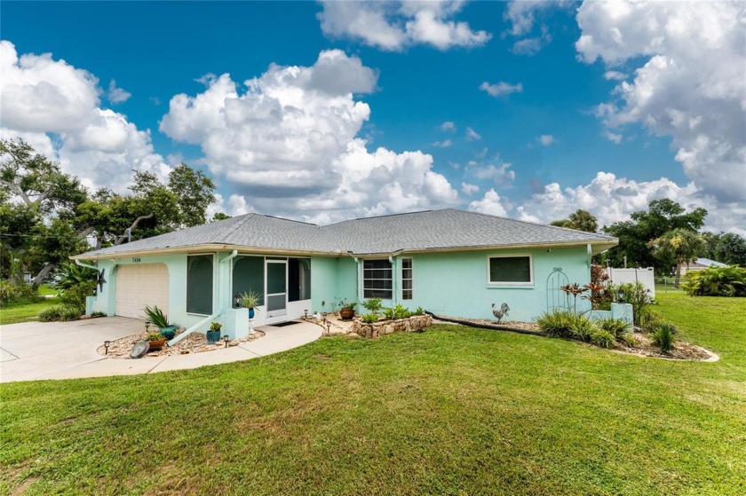 Welcome to your future oasis! Nestled on nearly an acre this - Beach Home for sale in Port Charlotte, Florida on Beachhouse.com