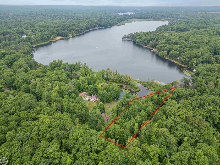 Nestled in a quiet cove on picturesque Cranberry Lake, this 1 - Beach Lot for sale in Harrison, Michigan on Beachhouse.com