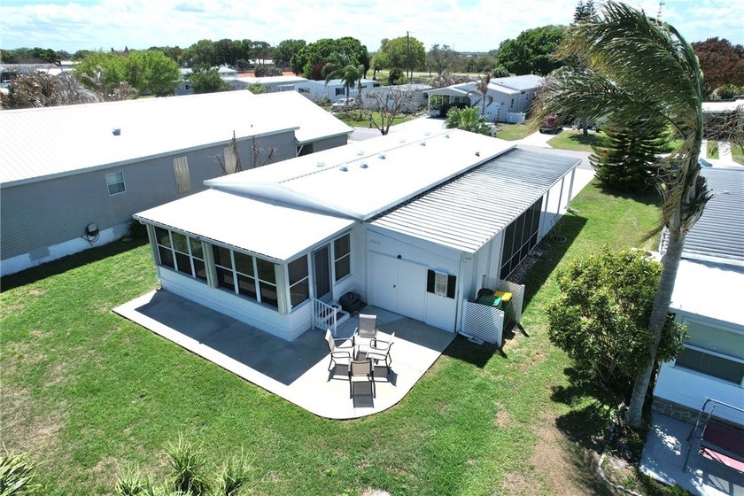 Direct golf course frontage with sweeping views from patio - Beach Home for sale in Barefoot Bay, Florida on Beachhouse.com