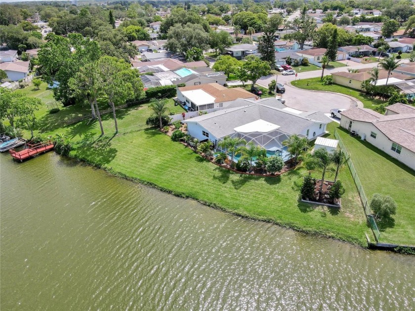 Welcome to your own slice of LAKEFRONT PARADISE! Tucked away at - Beach Home for sale in Port Richey, Florida on Beachhouse.com
