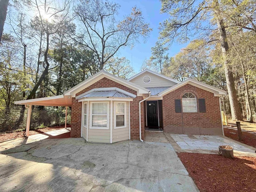 Fully remodeled and move-in ready! This 4BD/2BA home is tucked - Beach Home for sale in Tallahassee, Florida on Beachhouse.com