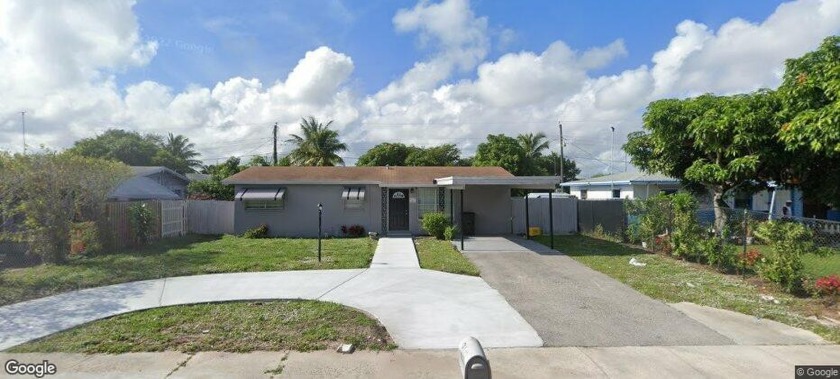 This one story 4 bedroom 2 bathroom home with carport in the - Beach Home for sale in Delray Beach, Florida on Beachhouse.com