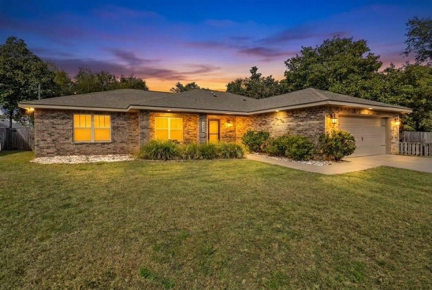 Welcome home to this beautiful south-facing brick home built in - Beach Home for sale in Gulf Breeze, Florida on Beachhouse.com