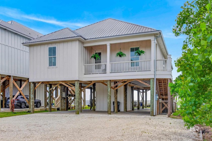 Set along the shores of Mobile Bay in Fairhope, this Gold - Beach Home for sale in Fairhope, Alabama on Beachhouse.com