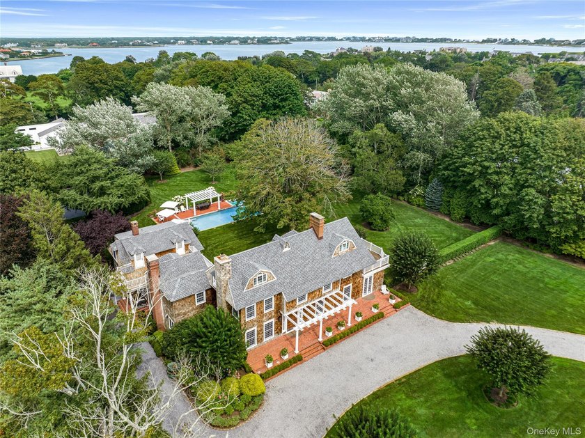 A storied village estate set behind nearly two gated acres - Beach Home for sale in Westhampton Beach, New York on Beachhouse.com
