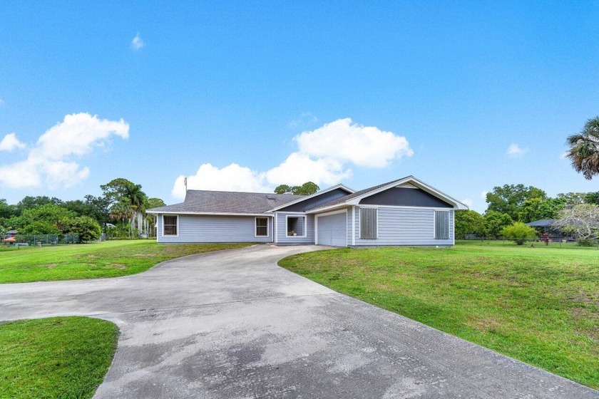 Welcome to this charming and well-loved home with 4 br and 2 and - Beach Home for sale in West Palm Beach, Florida on Beachhouse.com