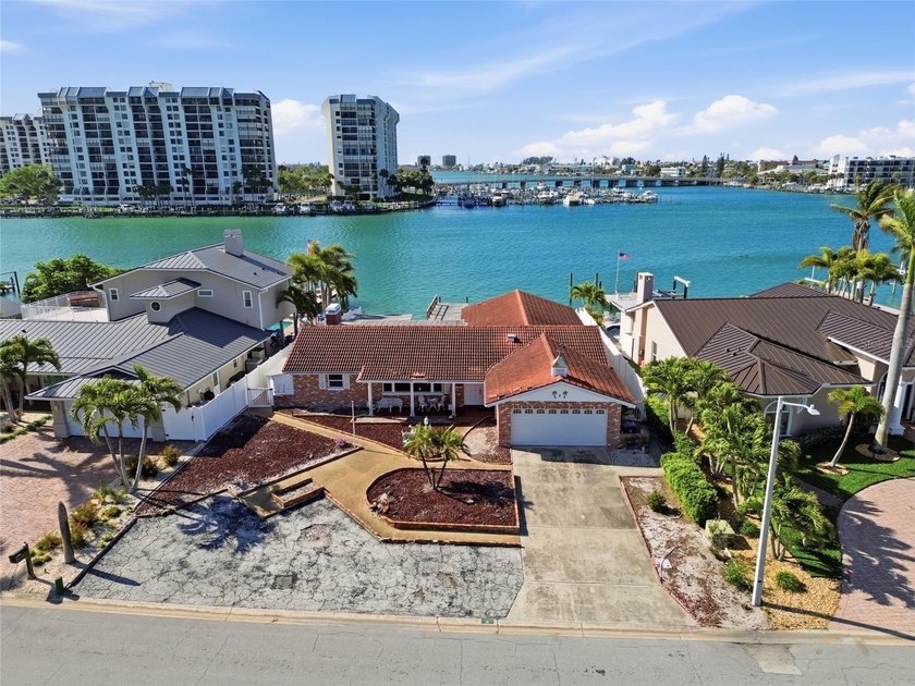 Located on a quiet cul-de-sac on Paradise Island, this 9,518 SF - Beach Home for sale in Treasure Island, Florida on Beachhouse.com
