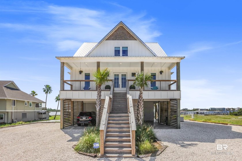 This stunning 6-bedroom, 4.5-bath waterfront retreat on Ono - Beach Home for sale in Orange Beach, Alabama on Beachhouse.com