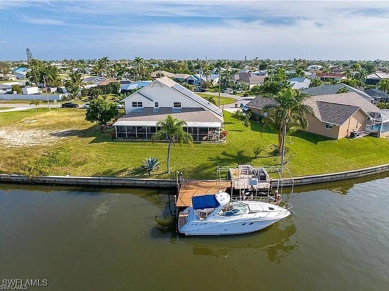 This one-of-a-kind Gulf-access home with intersecting canal - Beach Home for sale in Cape Coral, Florida on Beachhouse.com