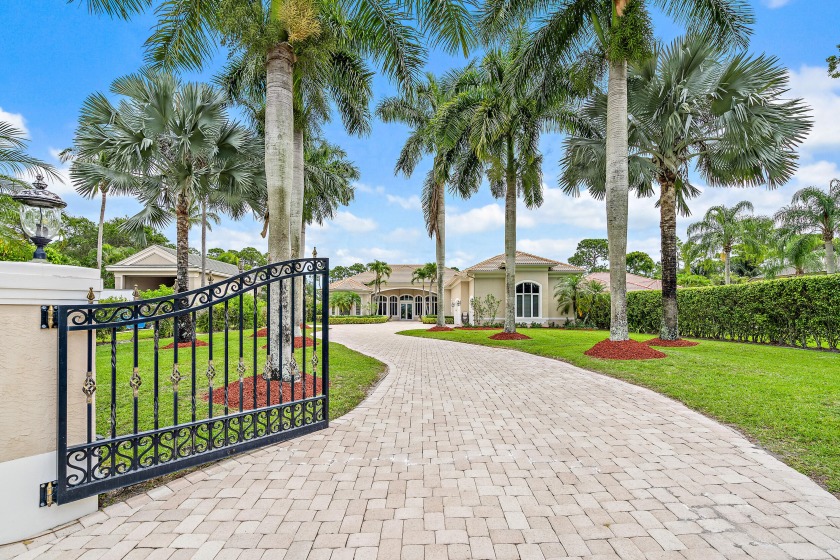 This beautiful custom home sits on a waterfront canal, only 5 - Beach Home for sale in Jupiter, Florida on Beachhouse.com