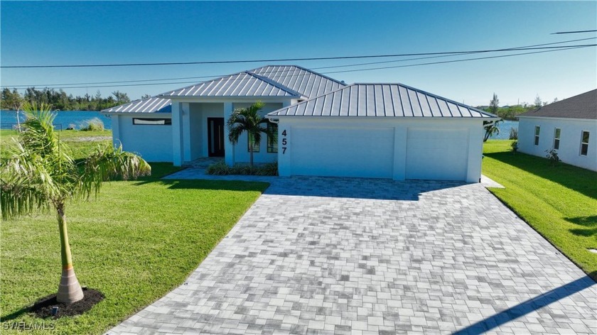 This newly constructed contemporary residence, completed in 2022 - Beach Home for sale in Cape Coral, Florida on Beachhouse.com