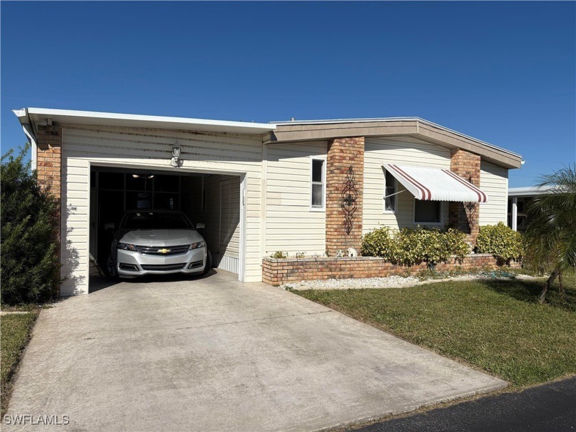 This lovely lake home is located in the highly desirable 55+ - Beach Home for sale in North Fort Myers, Florida on Beachhouse.com