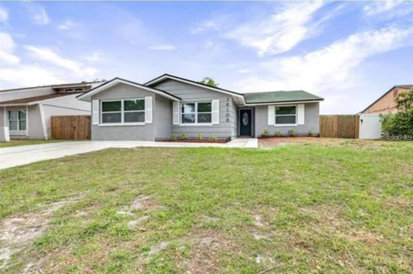 Welcome to this NO HOA lakefront retreat in sought-after - Beach Home for sale in Tampa, Florida on Beachhouse.com