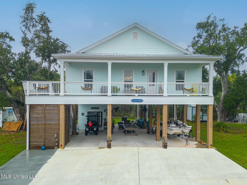 Embrace coastal living in this stunning, custom-built home with - Beach Home for sale in Waveland, Mississippi on Beachhouse.com